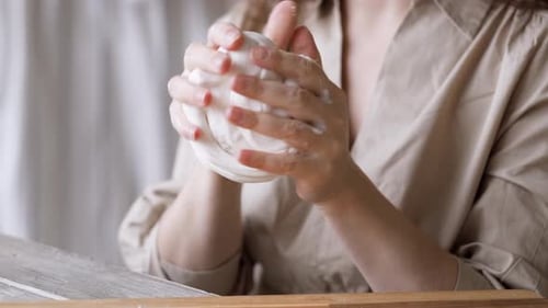 Woman Shaping White Clay in Art Studio