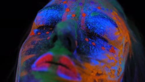 A Girl's Face with an Ultraviolet Pattern in the Light of a Fluorescent Lamp