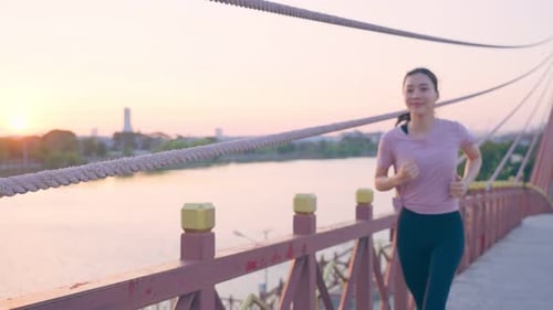 Asian young beautiful sport woman exercise by running workout on street in public park.
