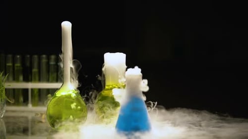 Bubbling Erlenmeyer Flasks Generating Smoke in a Lab