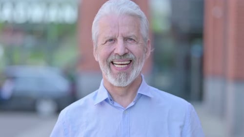 Smiling Senior Man with White Hair Close Up