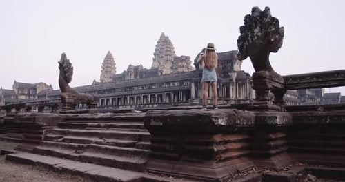 A WideAngle Shot of a Person Taking Pictures of a Magnificent Temple