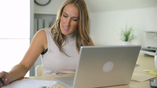 Businesswoman working on computer in office