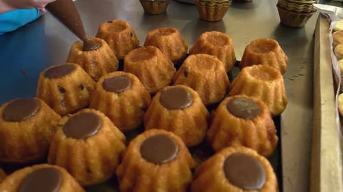 Chocolate Being Added to Baked Cupcake Dessert
