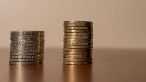 Stacks of Coins Increasing on Table
