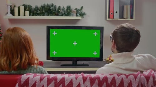 Family Couple Watching Green Screen TV