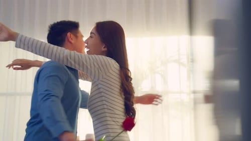 Romantic Couple Embracing After Rose Gift