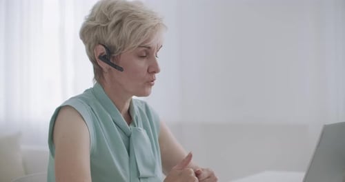 Woman Attending Video Call From Home Office