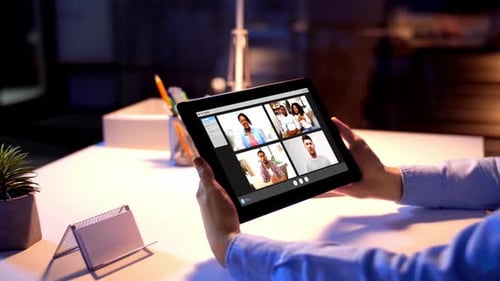 Businesswoman Having Video Chat at Night Office