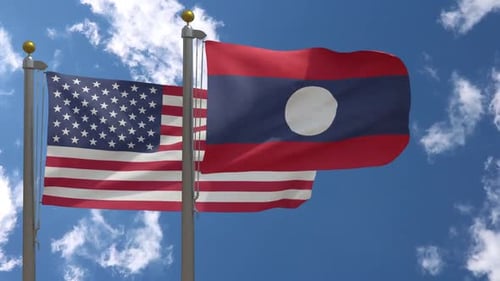 United States and Laos Flags Waving in Wind