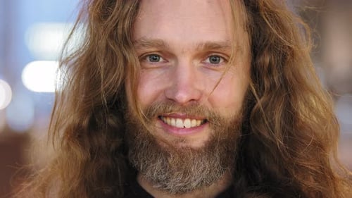 Smiling Man With Long Hair and Beard Close Up