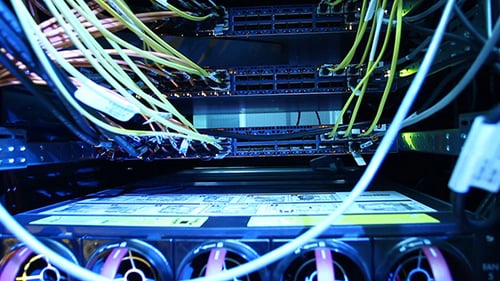 Server Cabinet with Glowing Cables and Blue Lights