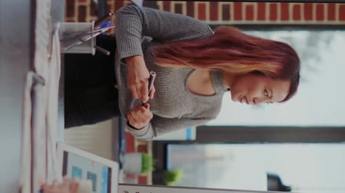 Young Woman Presenting Business Sales Projection Chart