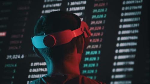Young Adult Using VR Headset with Data Wall
