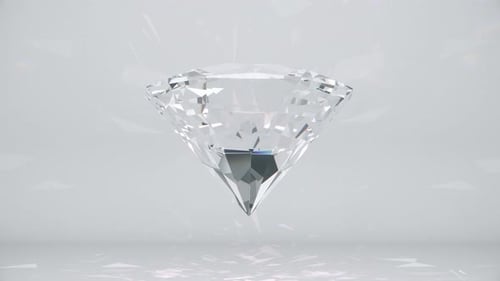Large Sparkling Clear Diamond Rotating Loop With Reflections on White Background