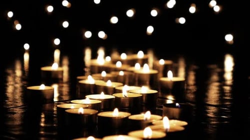 Glowing Candle Lights Illuminate Dark Space