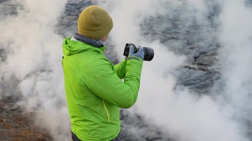 Photographer With Camera By Lava Flow From Erupting Fagradalsfjall Volcano