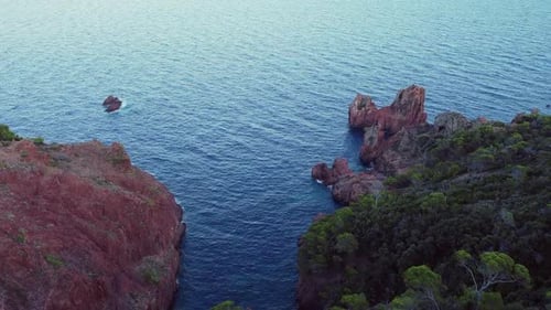A beautiful aerial landscape of the coast of France and the Golden Island at sunset