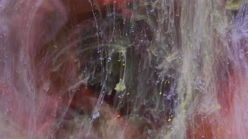 Abstract Colored Paints Intermingling on a Red Background