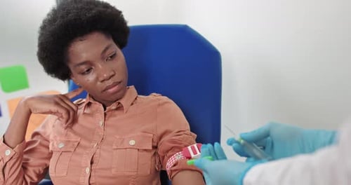 Adult Receives Injection From Medical Professional