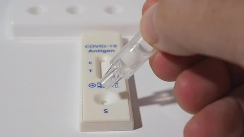 Liquid Being Dispensed Into COVID-19 Antigen Test