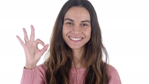 Woman Gives Okay Hand Sign With a Smile