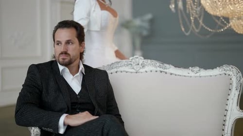 Elegant Couple Posing Formally Indoors