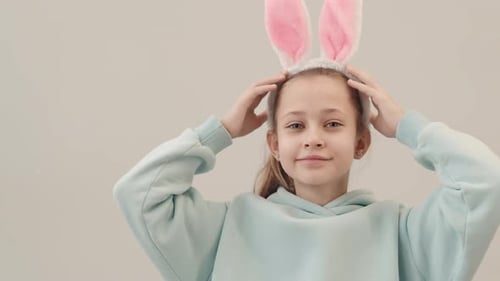 Girl Smiles and Wears Easter Bunny Ears