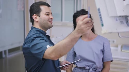 Medical Professionals Discuss Treatment in Clinic