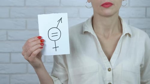 Adult Holds Gender Equality Symbol In Studio