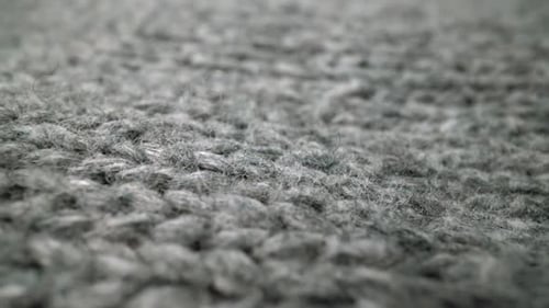 Extreme Detail View of Sheep Wool Cloth Texture Flowing in Macro Dolly Shot