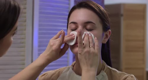 Facial Treatment for Beautiful Woman with Cotton Pads