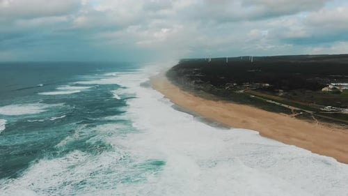 Azure Ocean and Rolling on Beach Foamy Wave Under Cloudy Sky