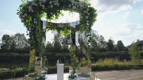 Unique Mirrored Wedding Archway with Flowers and Nature