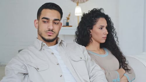 Stylish Couple on Couch, Not Talking After Disagreement
