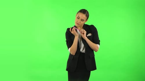 Girl Makes Herself Manicure with Pink Nail File. Green Screen