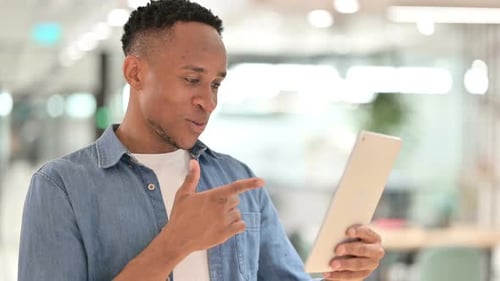Young Adult Video Calling on Tablet