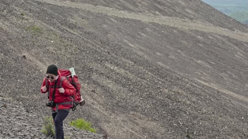 Woman Ascending Soil Mountain