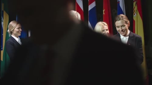 Businessmen Shake Hands at Corporate Event