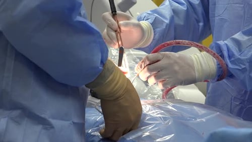 Surgeons Perform Procedure in a Hospital Operating Room