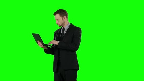 Business Man Using Computer. Green Screen.