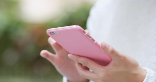 Close Up of Hands Using Smartphone