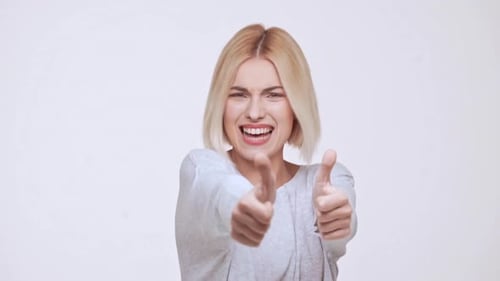 Blonde Woman Giving Two Thumbs Up on White