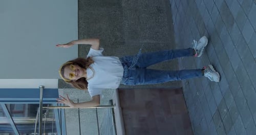 Cheerful Hipster Dancing Street Solo Front Camera in Stylish Look and Sunglasses