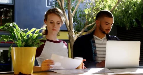 Executives working together in cafeteria 4k