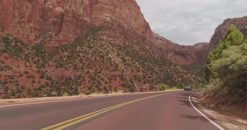 Driving Scenic Road Through Canyon Landscape