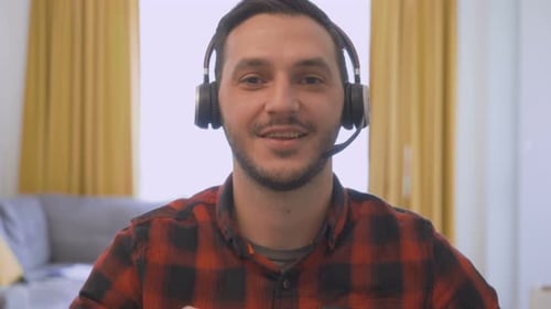 Young Man Communicating Online With Headphones
