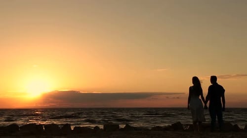 Romantic Couple in Love Enjoying Sunset on Beach
