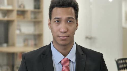 Young Adult Man Wearing a Black Suit Close Up