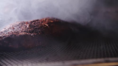Close Up of Smoking Cooked Meat on Grill